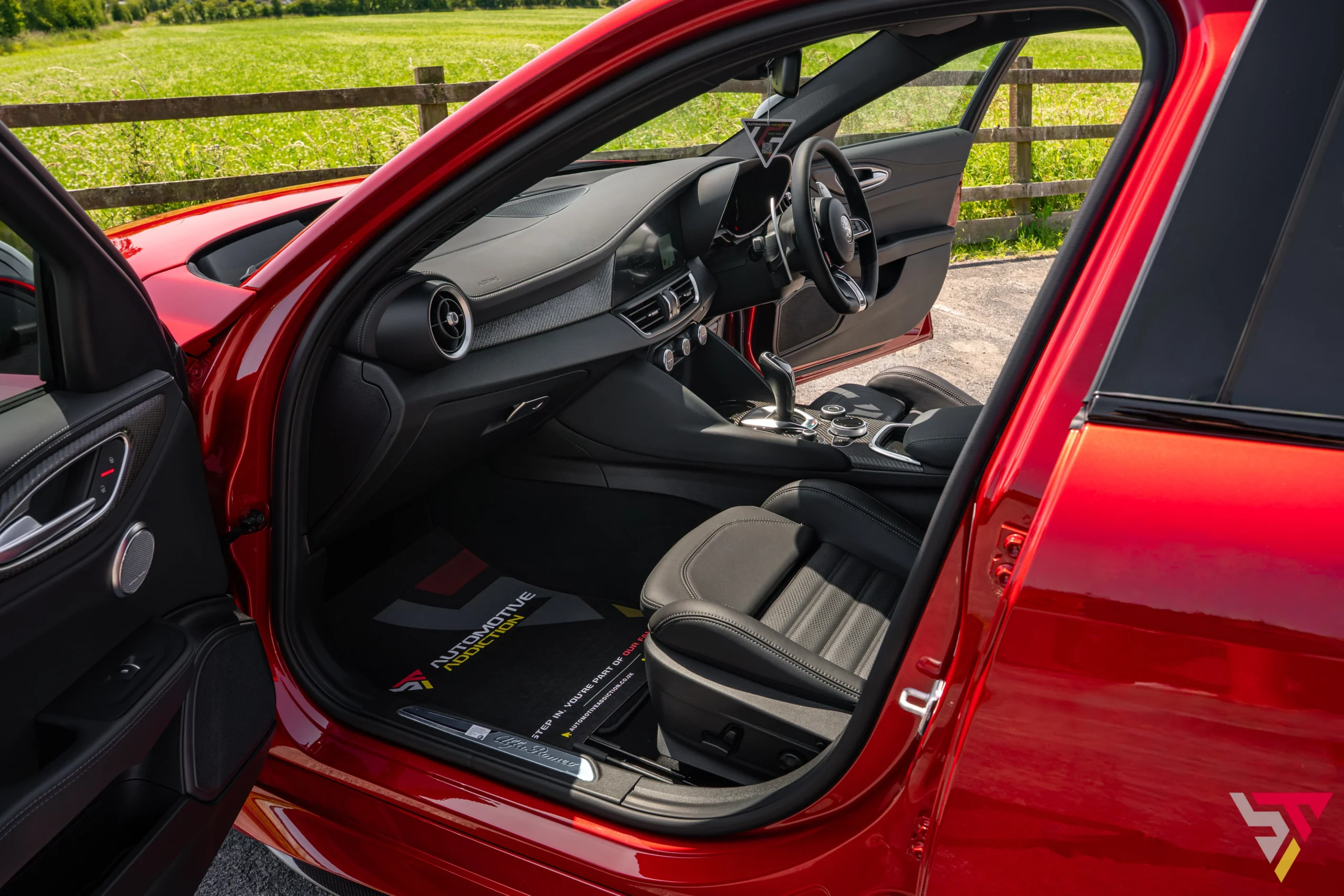 2026 Alfa Romeo Giulia Quadrifoglio Etna Red passenger dash