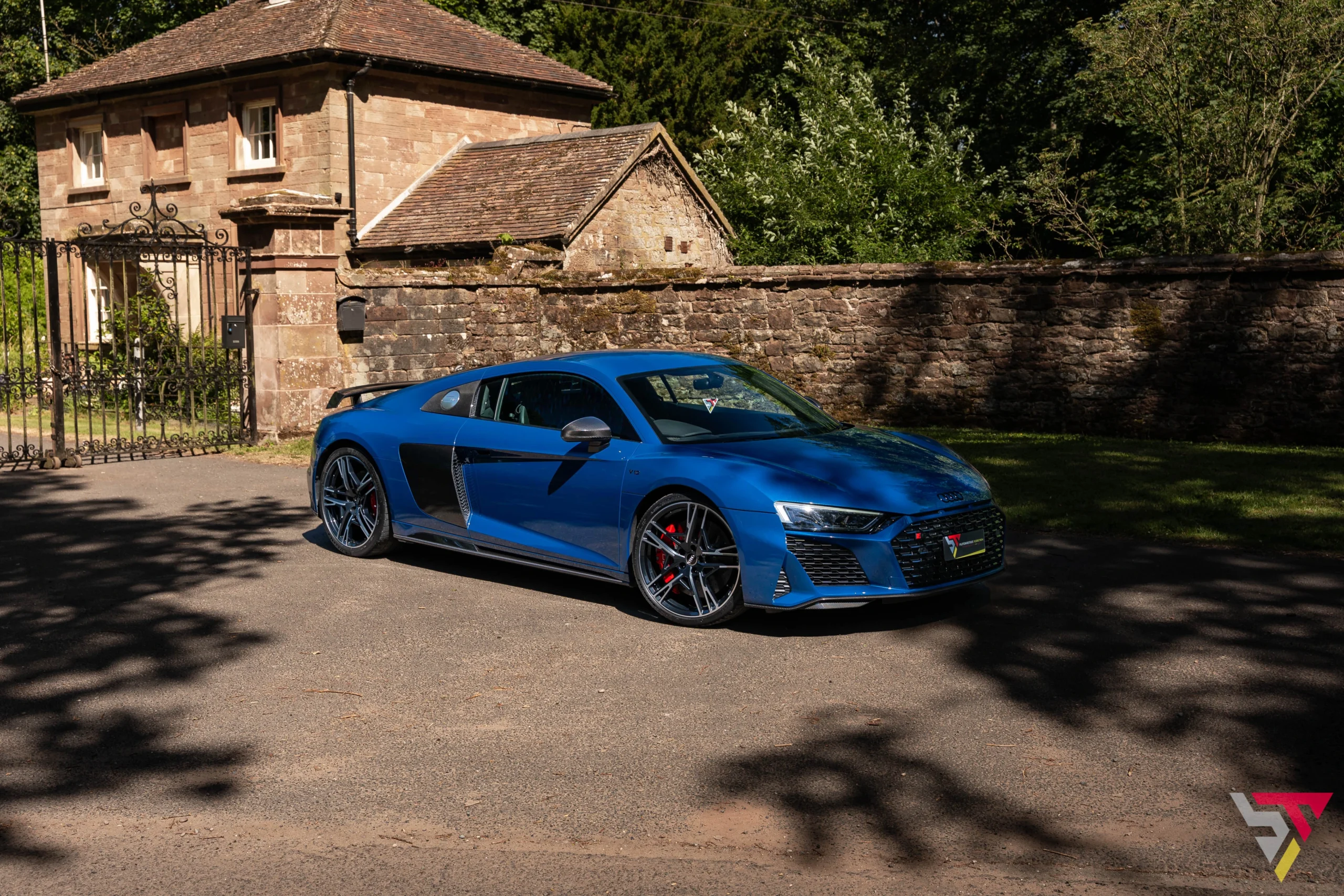 Audi R8 Performance Carbon Black Ascari Blue front angled