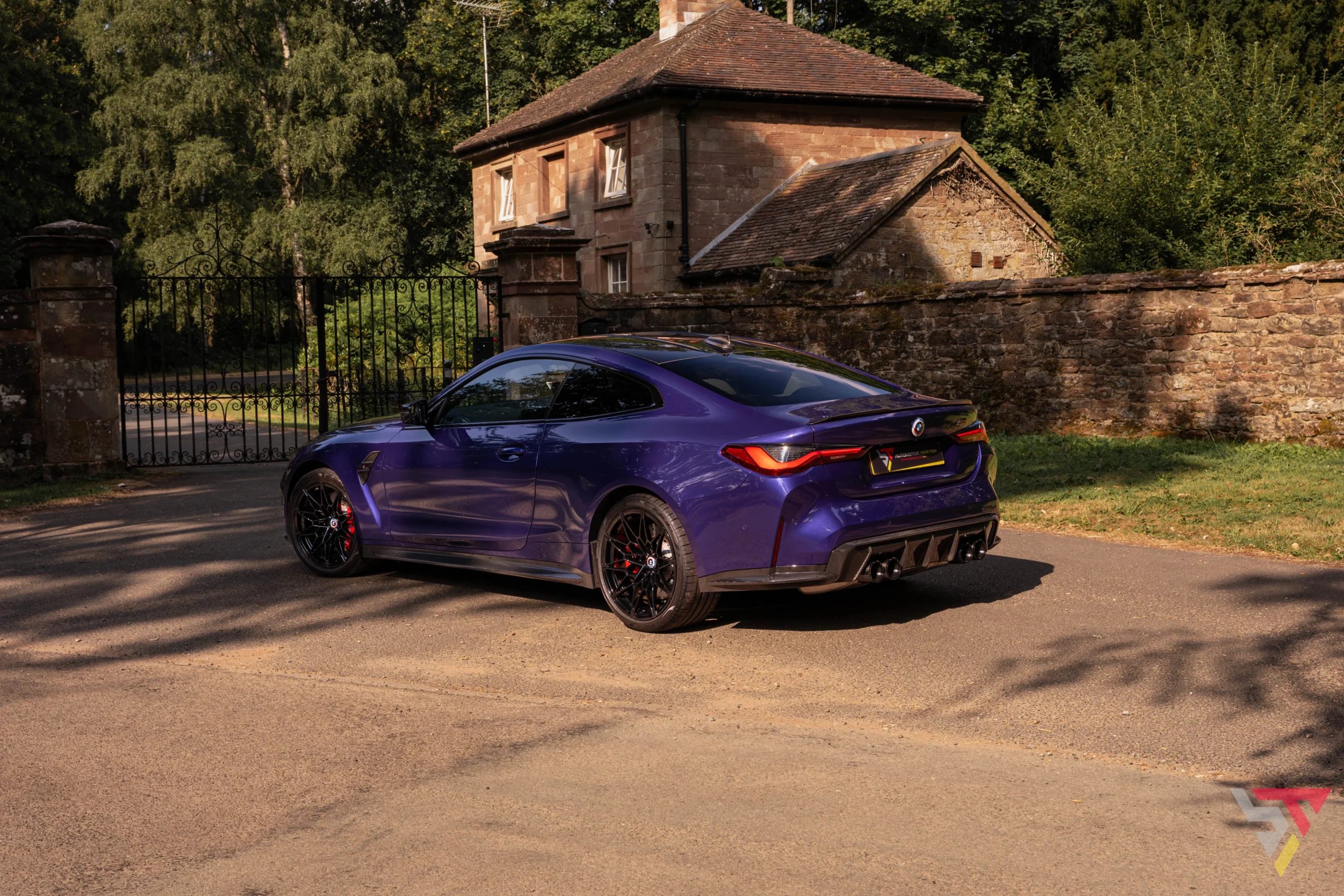 BMW Individual G82 M4 Ultimate Package Velvet Blue rear angled side