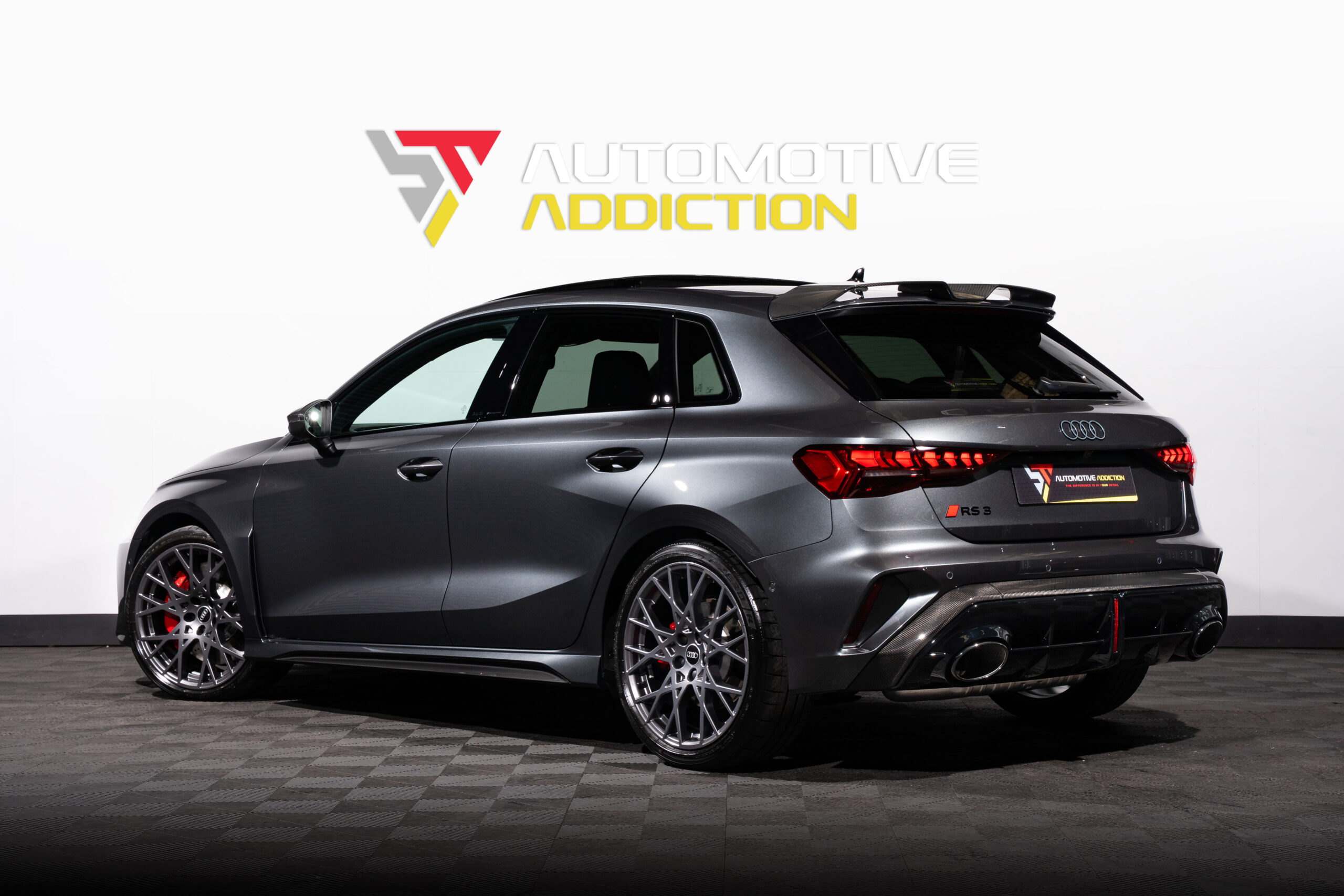 2025 Audi RS3 Carbon Black 8.5Y Sportback Daytona Grey rear angled
