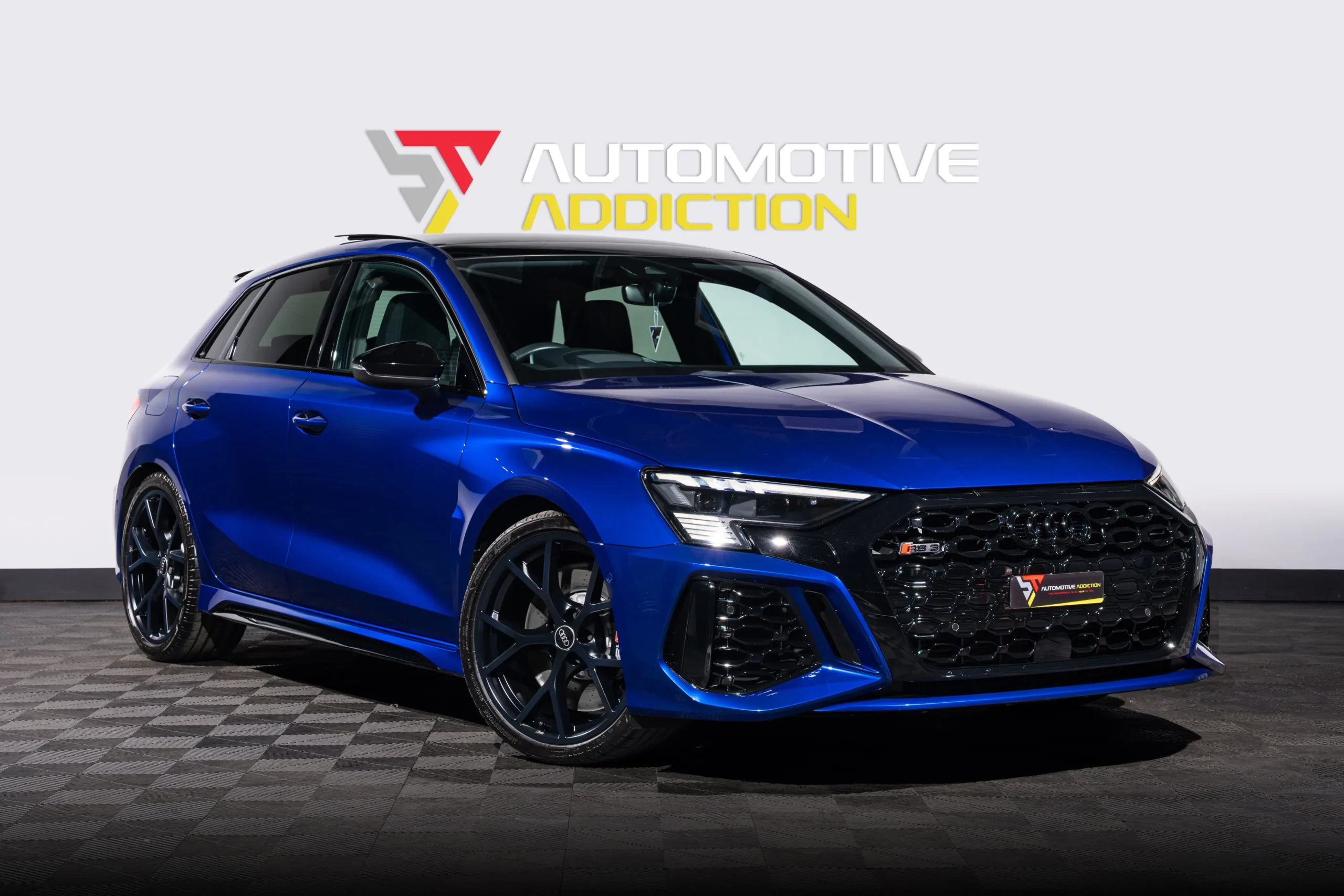 BMW San Marino Blue Audi RS3 Sportback Front Angled