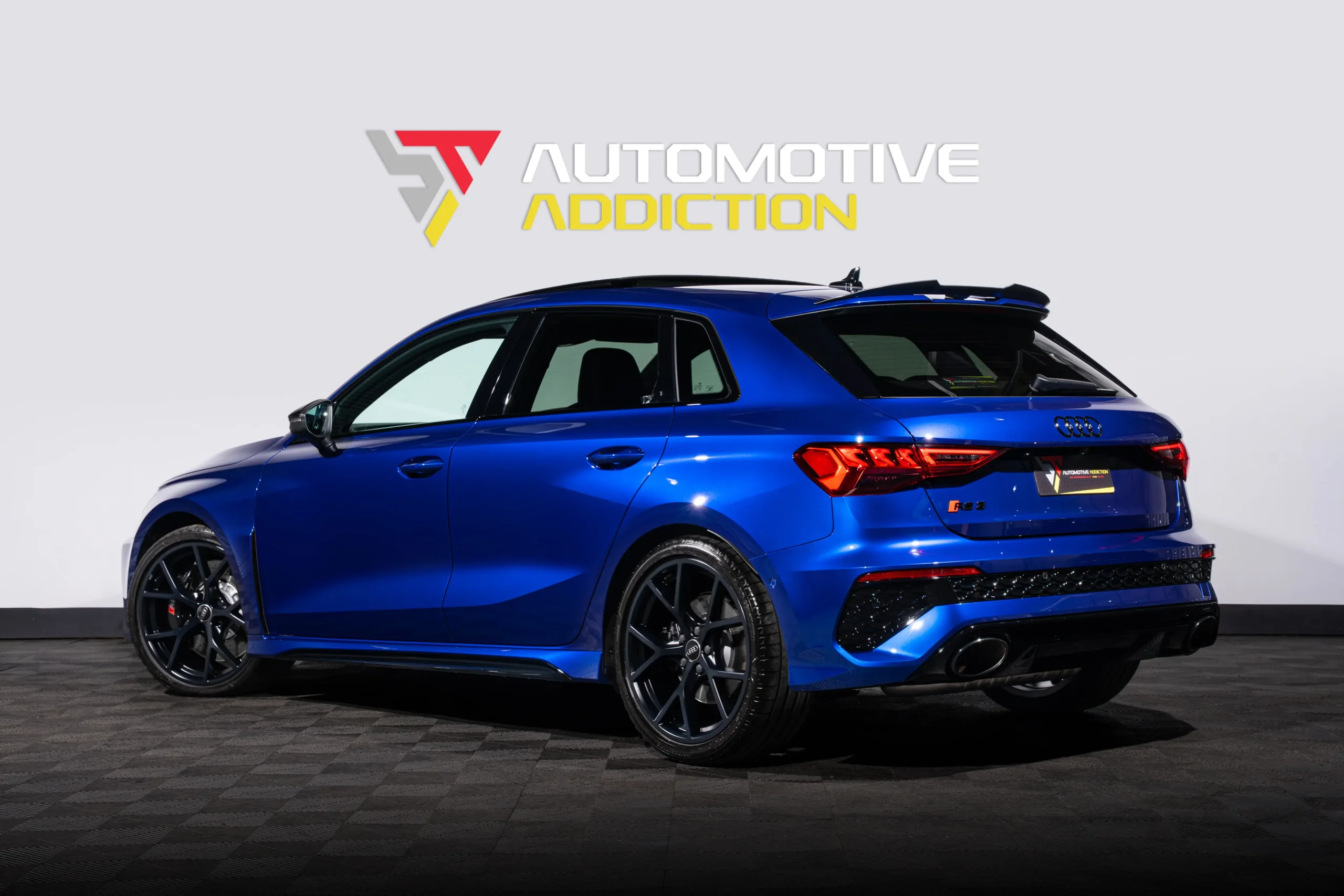 BMW San Marino Blue Audi RS3 Sportback Rear Angled